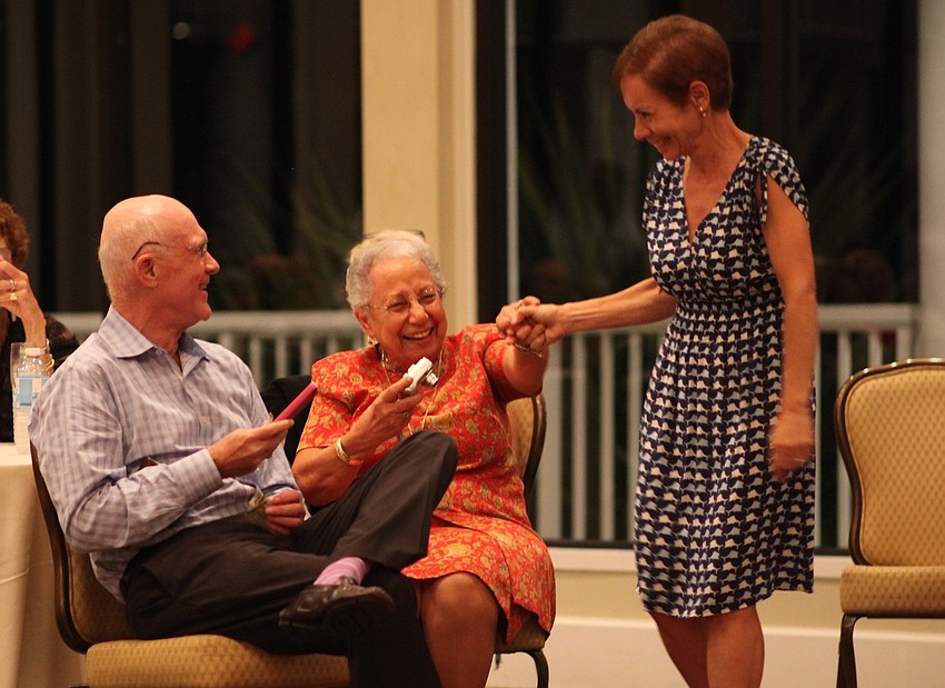 Phillip Younger and Blanca DiCecco cheer on model Fanny Younger after her walk down the runway.