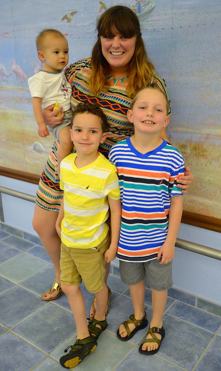 Back, Joshua Kilgore and Corrine Adams; Front, Michael and Oliver Adams