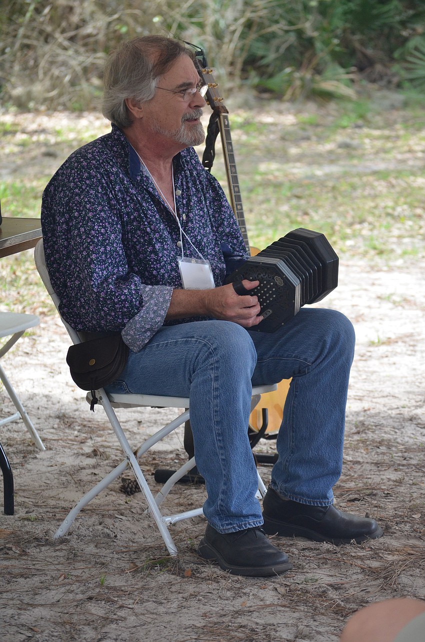 Bill Schustik plays a concertina.