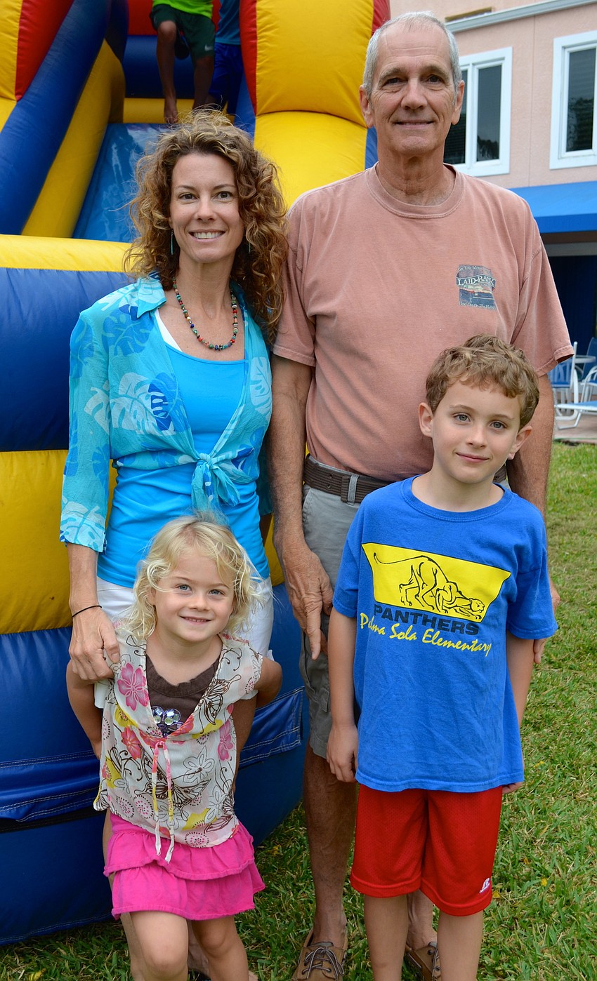 Back, Angela Varga with her father, Larry Kennedy; Front, Ava and Austin Varga