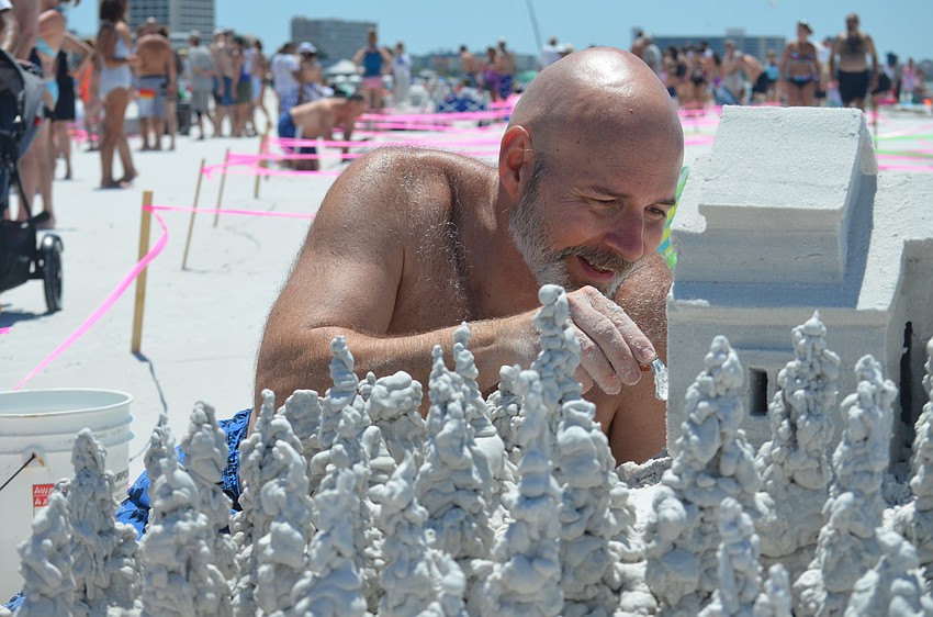 Ken Shields works on his sculpture.