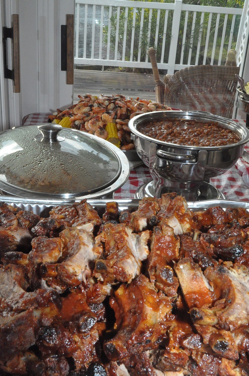Phyllis and Jack Black, with the help of Teresa Truitt, served a low country boil, ribs, potato salad and coleslaw.