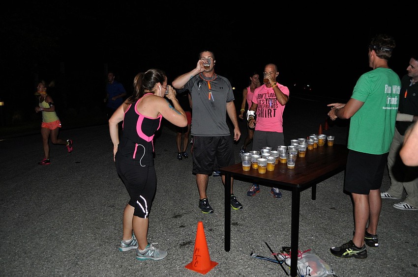 Runners took a break at the half way mark of the 5K to have some beer.