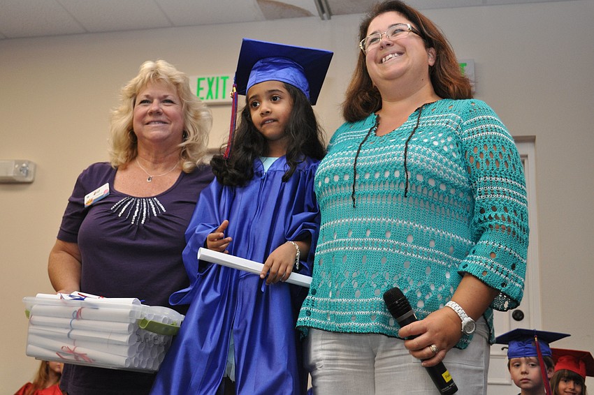 Namita Kondabala, center, received her diploma from her teachers,, Debbie Frazzoni, left, and Karen Kieran, right, after receiving her diploma.