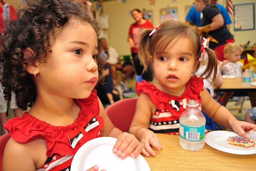 Two-year-olds Dylan McBrayer  and Andi Azevedo wear the same outfit for their classâ€™s parade.