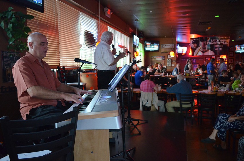 Gary Kauffman and Robert Turoff perform audience requests for donations