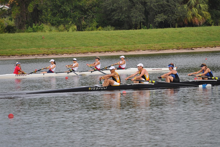 Competitors in the mixed 4s race toward the finish line.