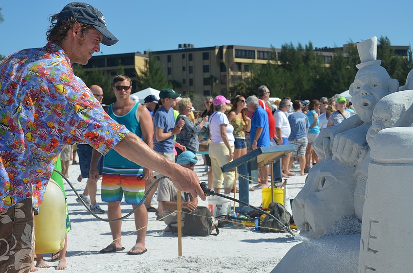 Abe Waterman works on his sculpture