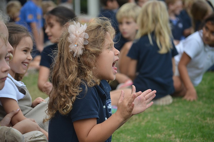 Maya S. cheers from the sidelines