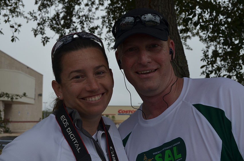 Tamara Monroe supported Michael Shultz at the finish line.
