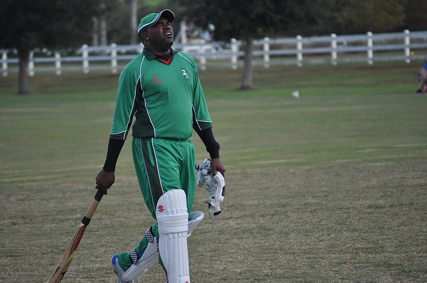 A Cayman Islandsâ€™ batsman reacted to an out.