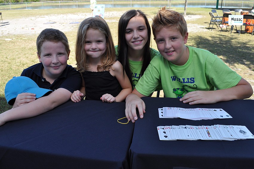 Harvey and Taylor Combe, Lindsey Chandler, and Jake Combe hang out together as Harvey and Jake show off magic trips.