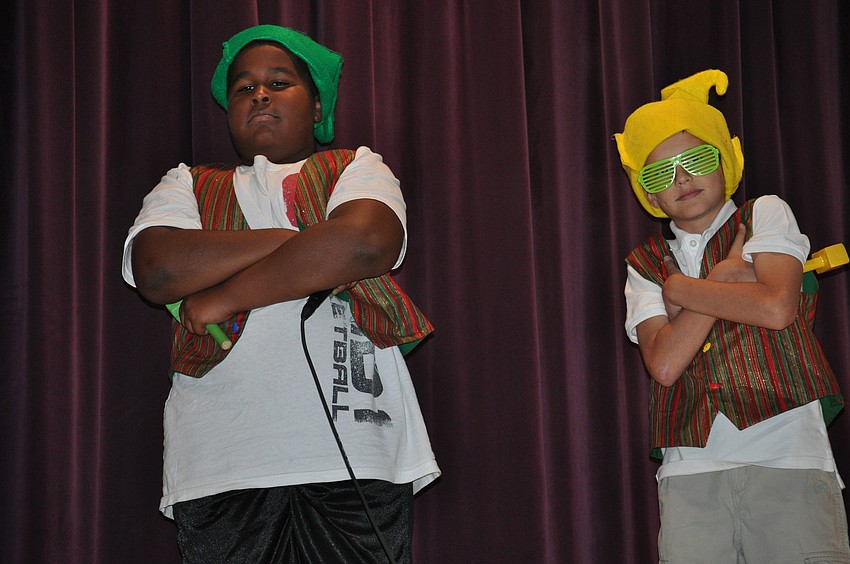 Casalo Moody, an elf named Snores-A-Lot, and Dean Albrecht, an elf called A-Choo, posed after rapping.