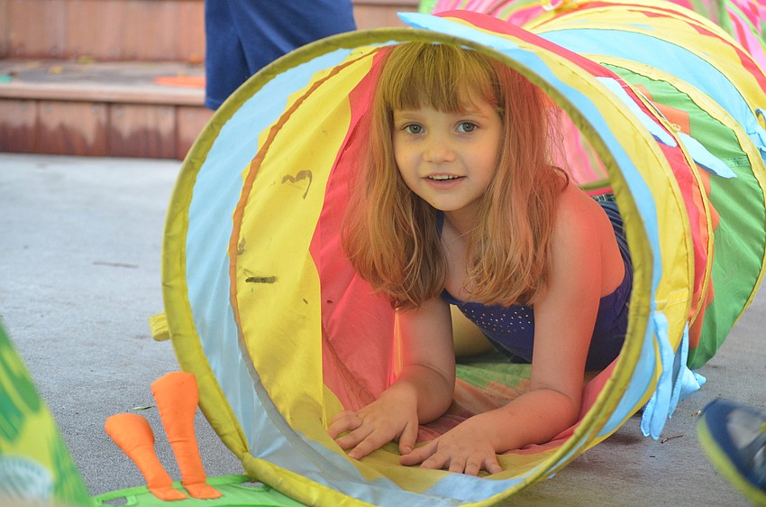 Addison Weimann crawls through the tunnel.