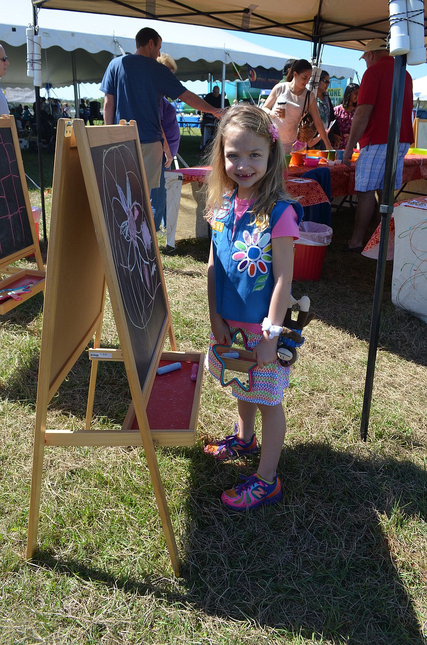 Maggie Layman prepares to draw with chalk.
