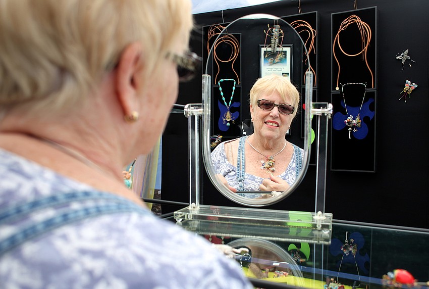 Carol Cohn tries on her unique new necklace from Jewelry10.