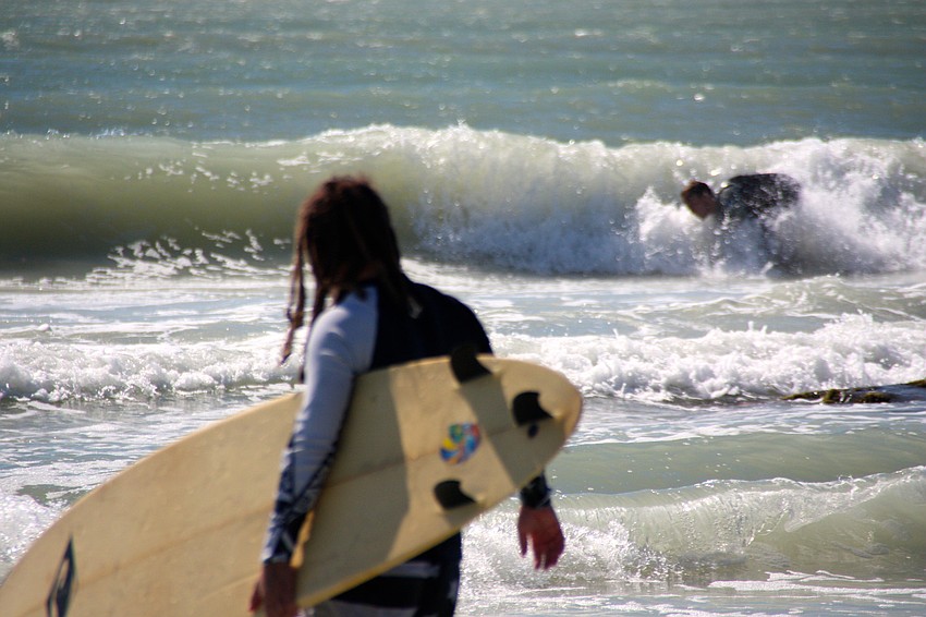 Surfers at Lido Beach.