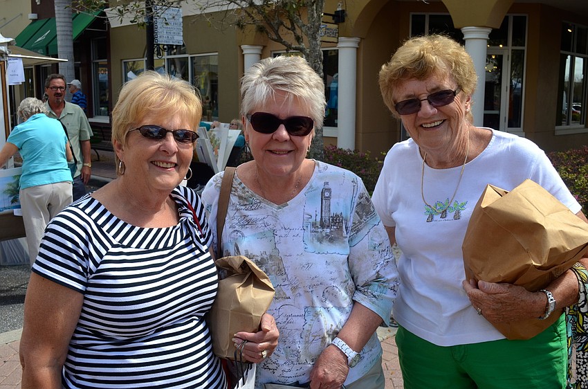 Susan Torre, Jan Rourke and Fran Murray enjoy looking at art.