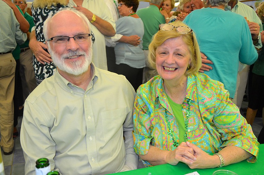 George Meyer and Jeri Stangl take a break from dancing.