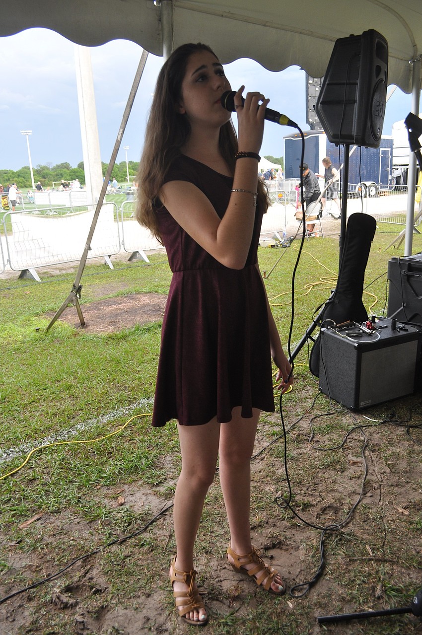 Eliza Lipton, an 8th grader at Manatee School for the Arts, sings.