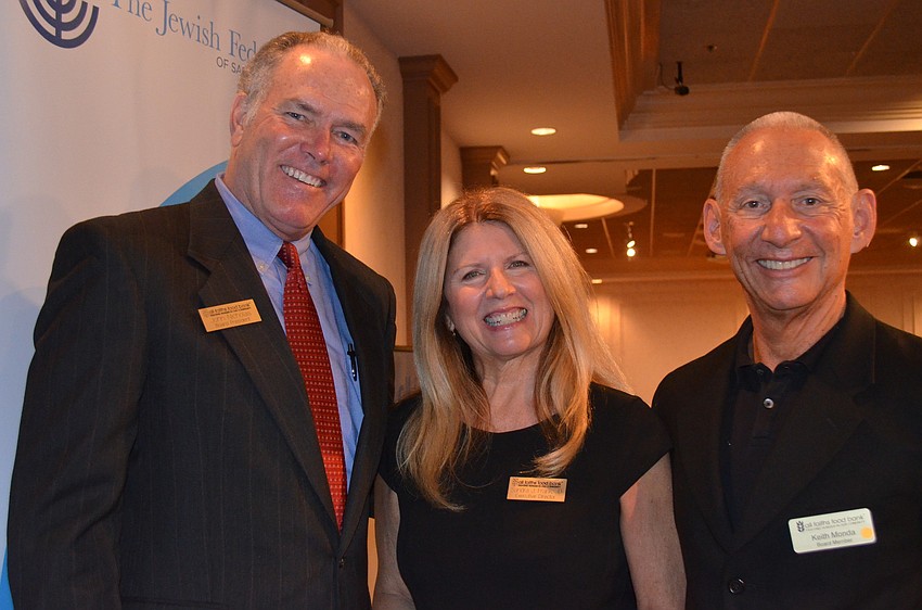 All Faiths President of the Board John Nicholas, All Faiths Food Bank CEO Sandra Frank with Board Member Keith Monda