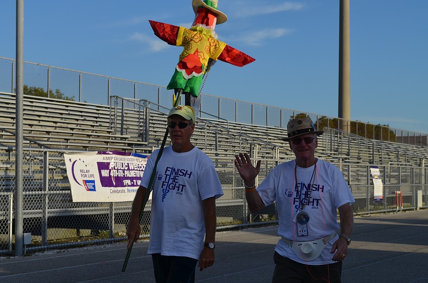 Bill Watson and Dave Swartz walk together.