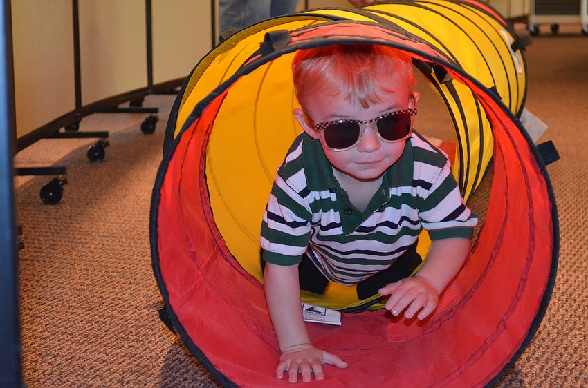 Samuel Zoller wears sunglasses to see what it was like in total darkness.