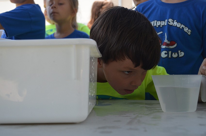 Wyatt Schoenberg measures water.