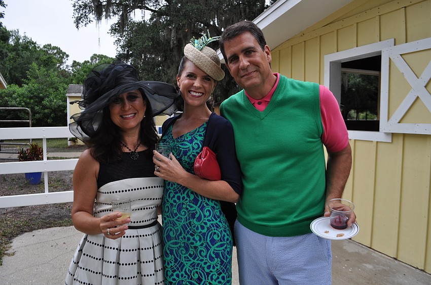 Denise Drizos and Shari and Doug Phillips visit the stables.
