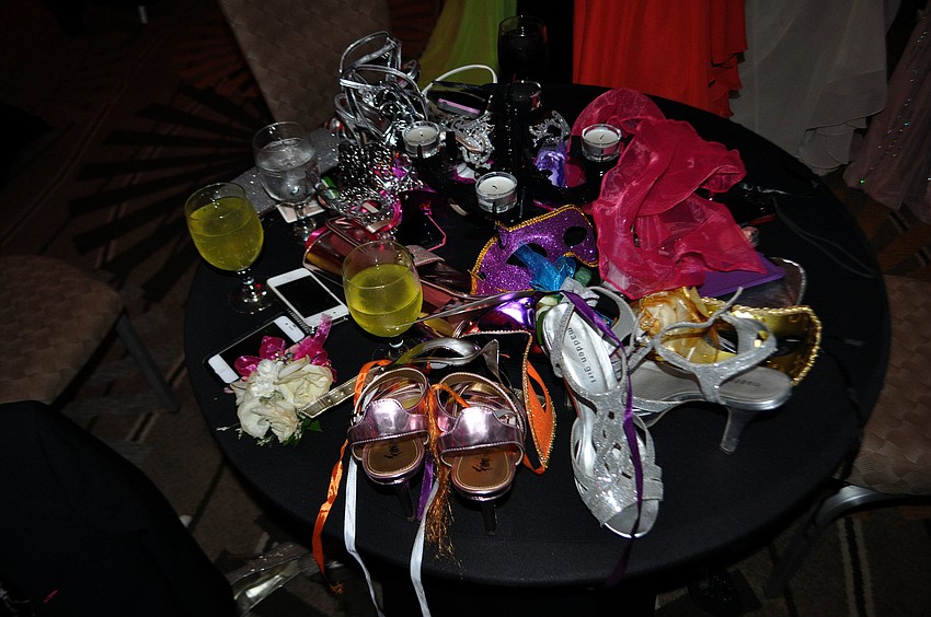 Purses, phones, shawls and shoes were left on tables early on as the students made their way around the room and on the dance floor.