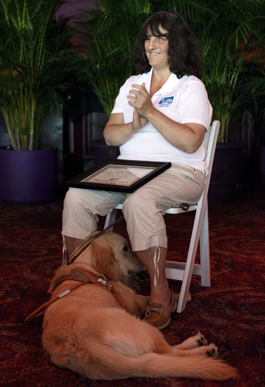 Rhonda Partain claps for her fellow graduates.