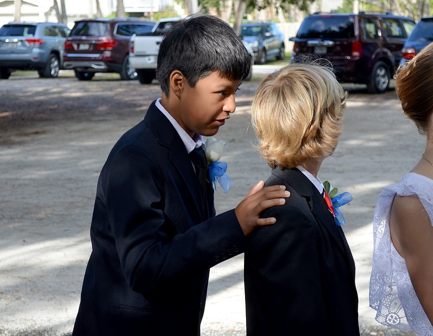 Tomas and Oliver prepare for the graduation ceremony.