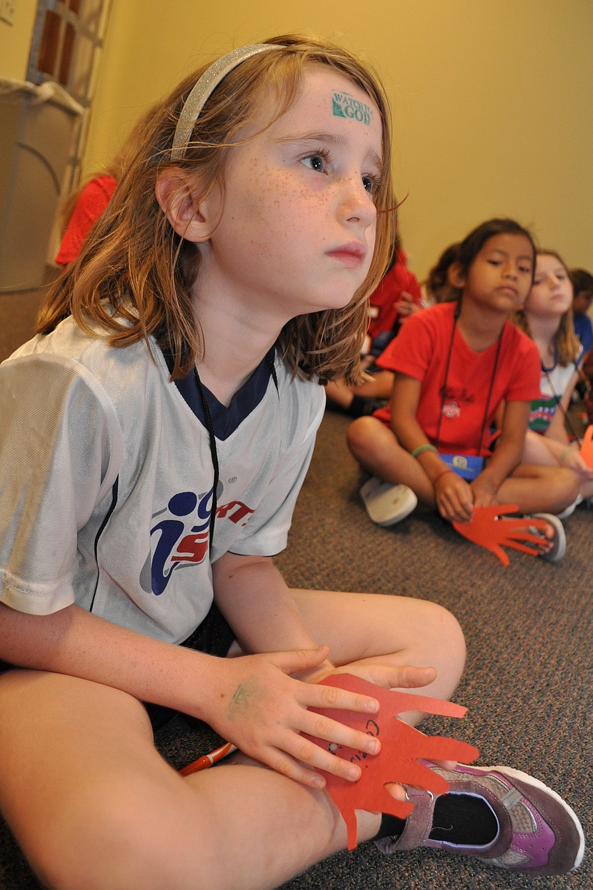 Caleigh Patterson, 6, listens during story time.