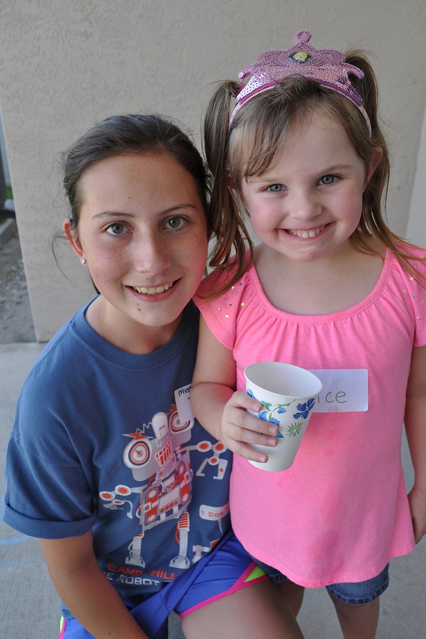 Counselor Taylor Wolf gets a smile from Alice Barr, 4.