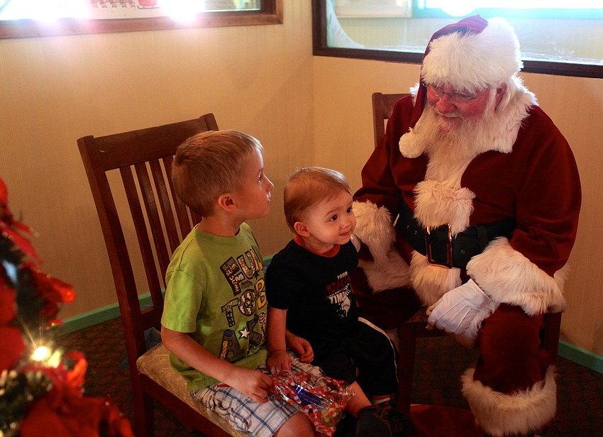 Carson Johnson and Brian Nipper tell Santa what they want for Christmas.