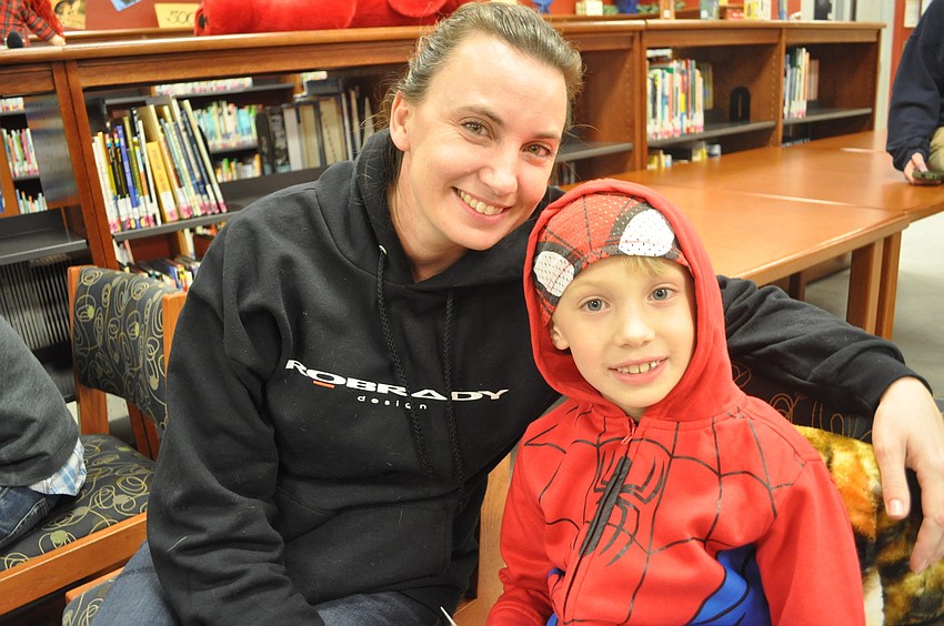 Adriane Elcoro and her first-grade son, Julian, listened to a story.