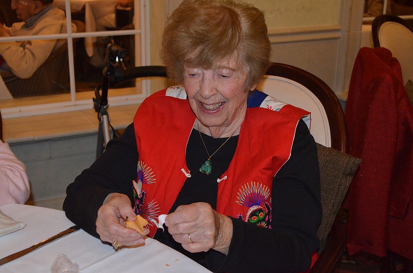 Beatrice Michaels opens her fortune cookie.