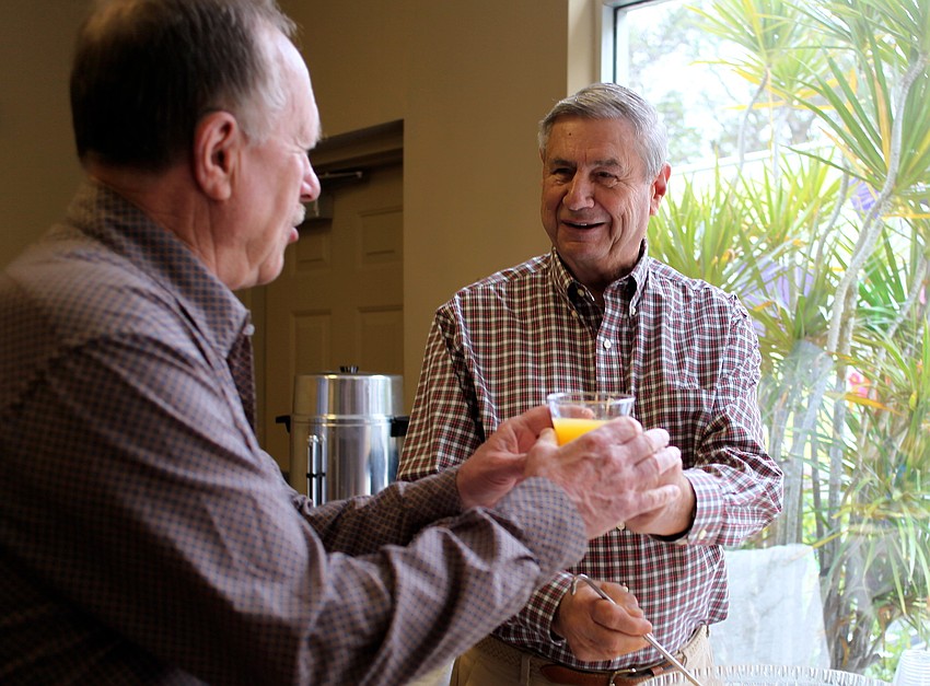 Tom Reese pours punch for Jerry Witmer.