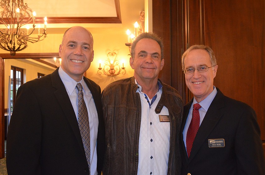 Adam Sulimirski from Cruise Car, Darrell Turner of Turner Tree and Landscape with Chamber Board Member Richard Webb