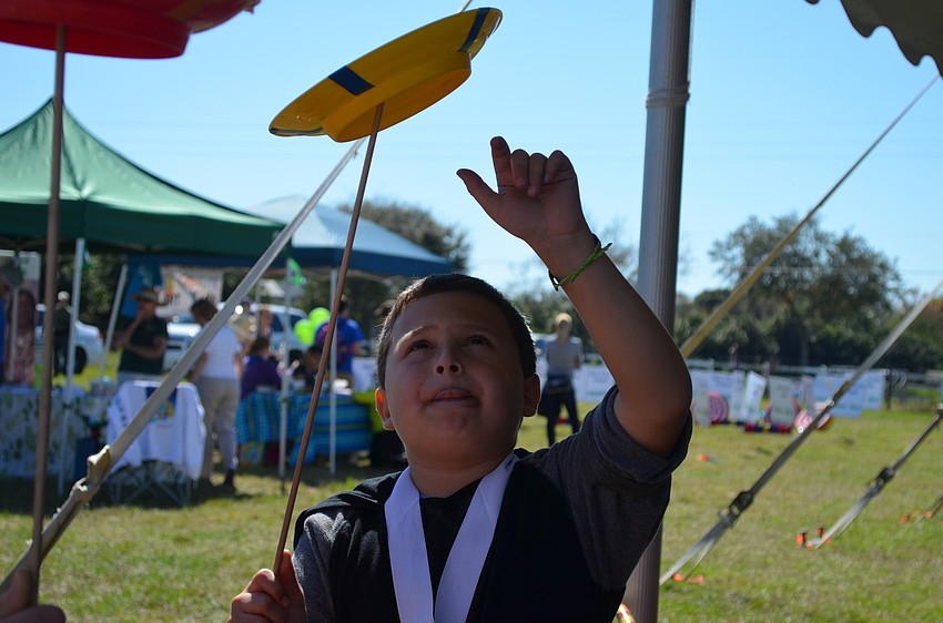 Devin Rubinstein spins a plate.