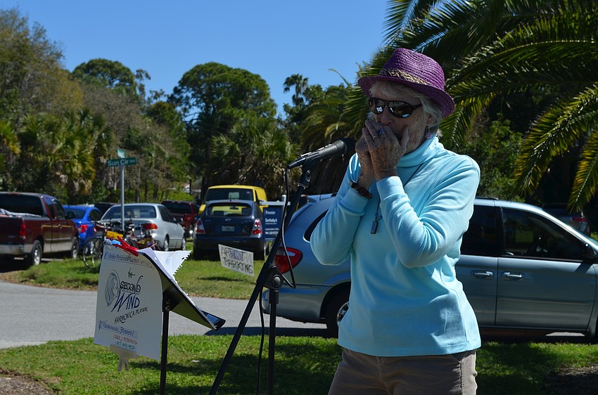 Carol Pettengill plays the harmonica.