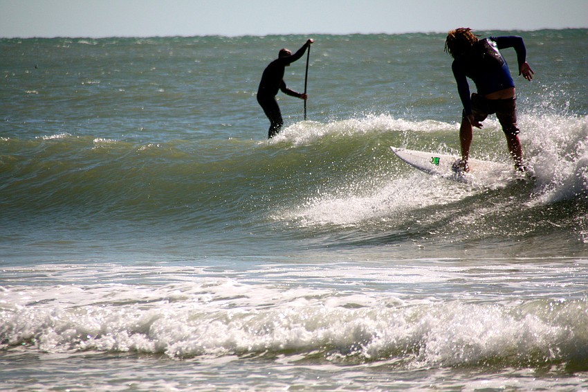Surfers at Lido Beach.