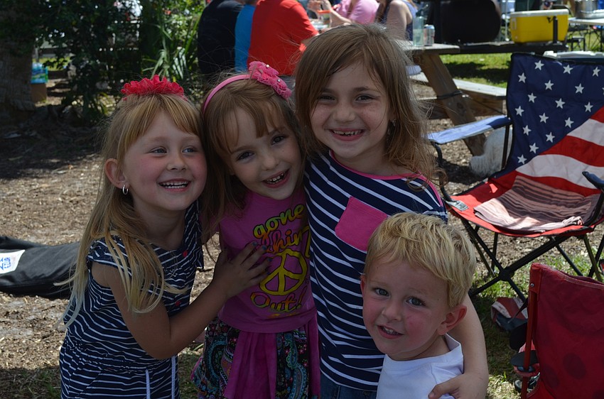 Payton Snyder, Hayden Taylor, Julia Jekonski and Ethan Snyder hang out behind Station 1 of downtown Sarasota.