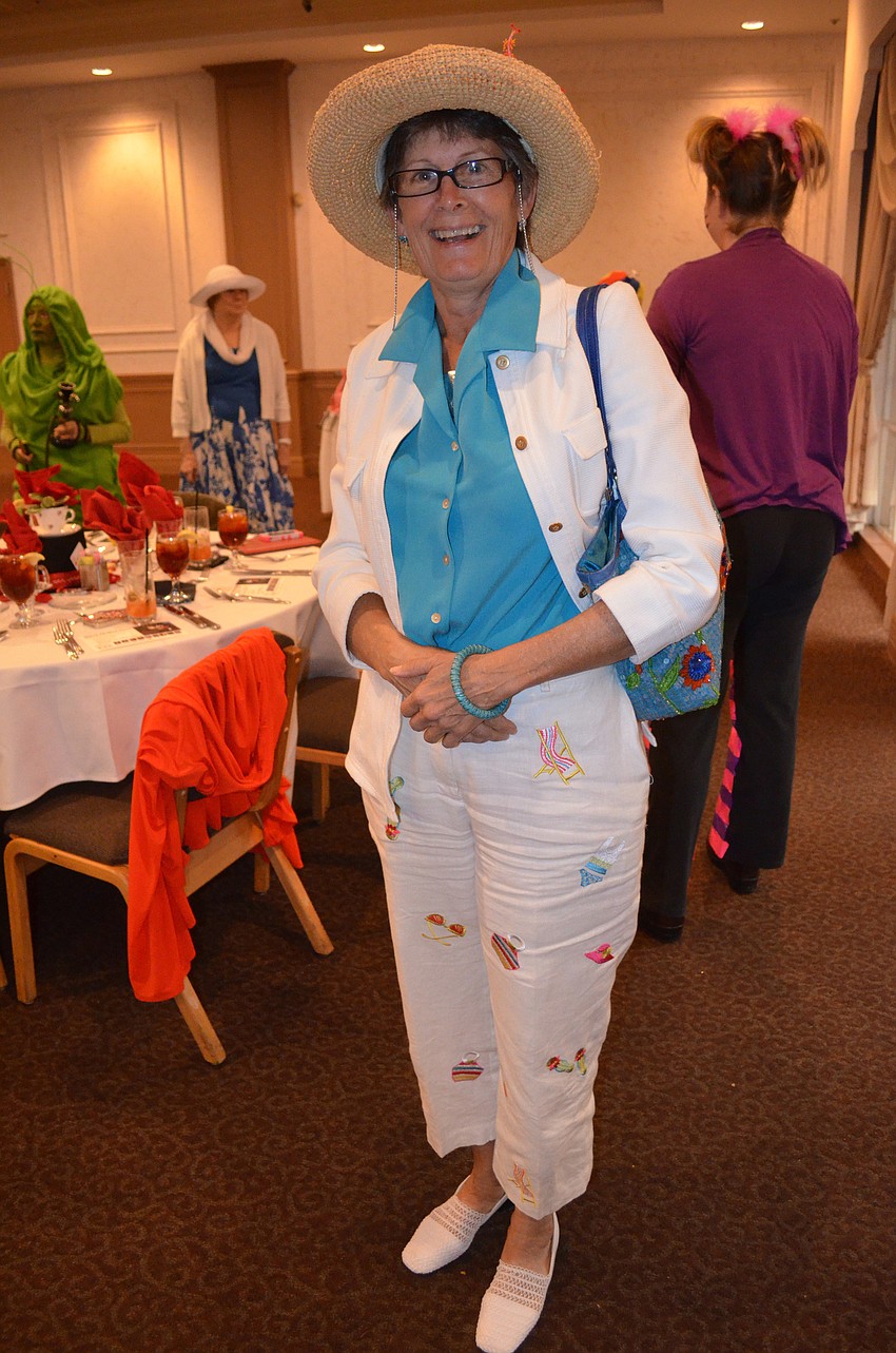 Terri Nowes wears a hat-themed outfit.