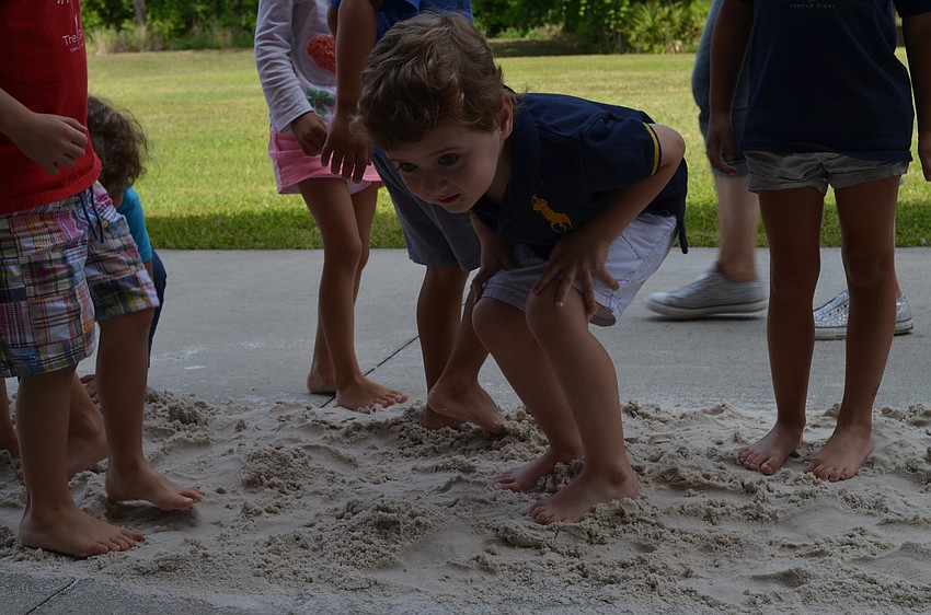 Alexander Nir takes a break from walking through the desert.