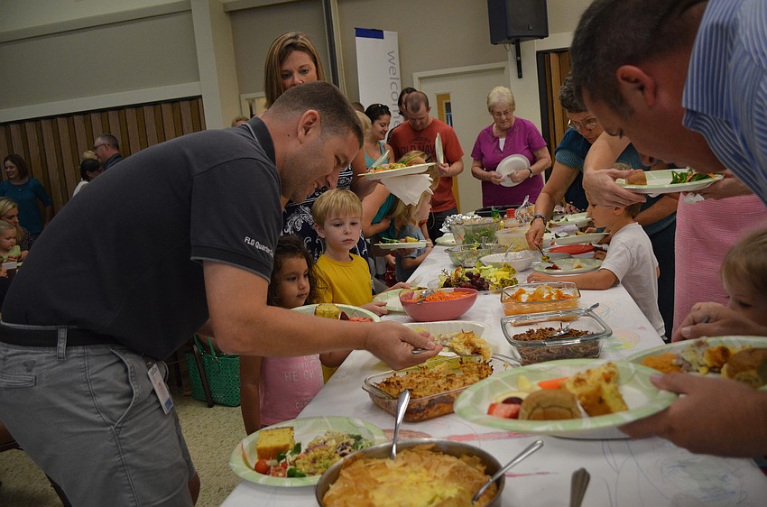 The meal included ham, corn, biscuits and vegetables.