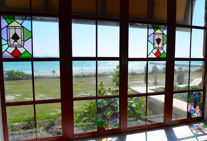 Restored stained-glass windows offer views throughout the home.