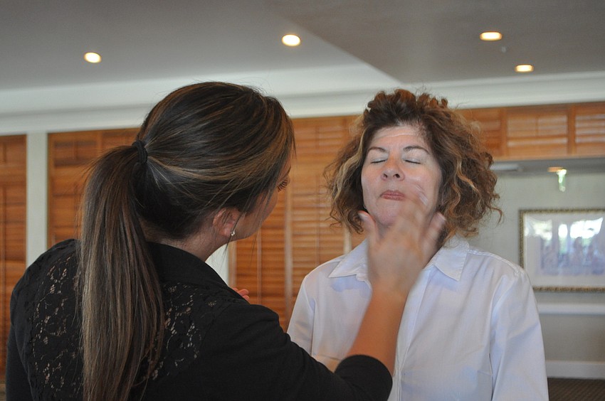 Cassie Bale applies foundation to Dori Zingmond