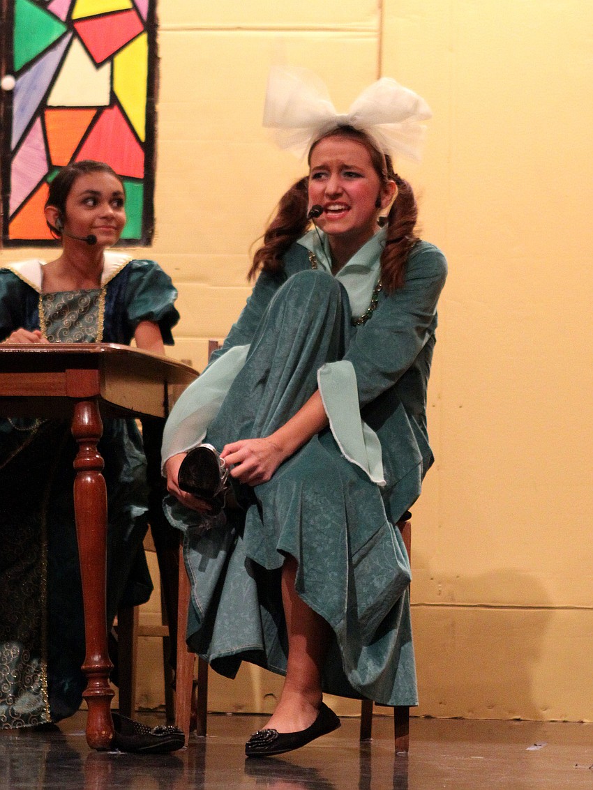 Joy, Madison Chaney, tries to force the slipper onto her foot.