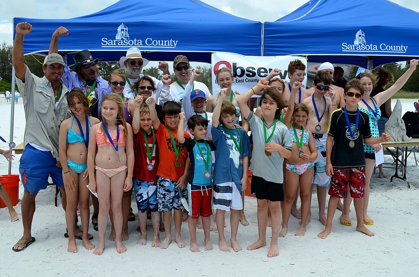 Winners show off their medals.